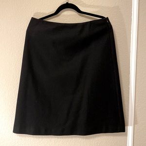Black wool skirt with lace-up detail on back